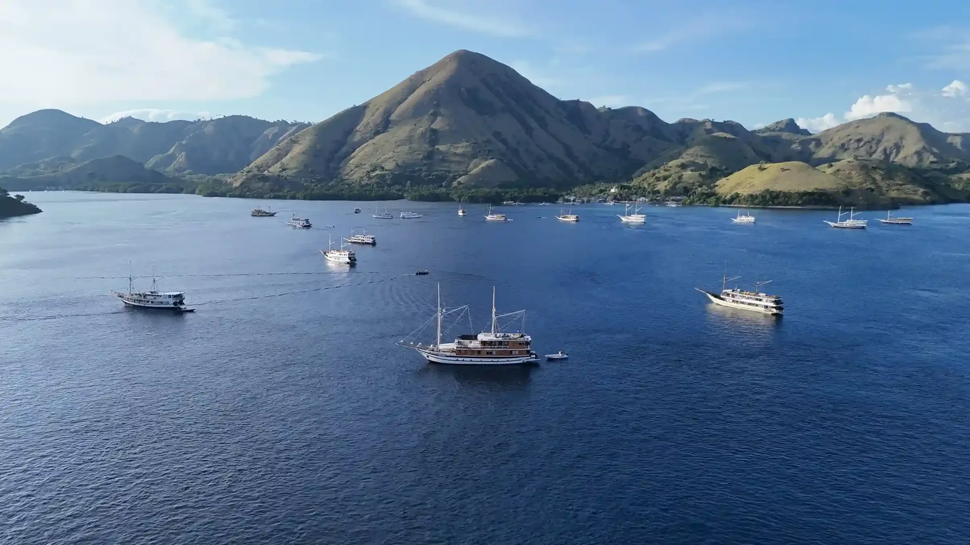 Boats at anchor in a sheltered bay of Komodo National Park