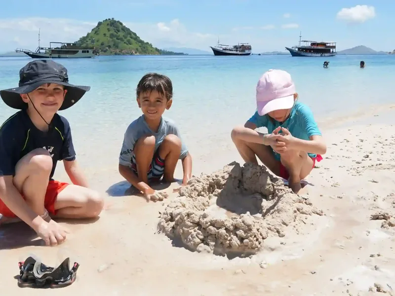 Children playing on the beach of Kelor Island, Komodo