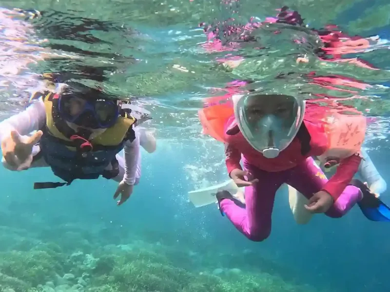 Children snorkeling near Labuan Bajo