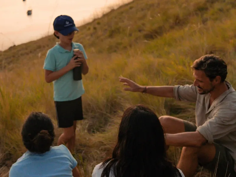 Children trekking on Padar Island with a guide
