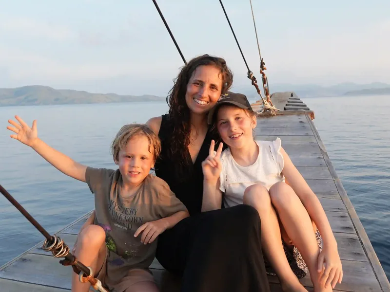 Family on the deck of a phinisi in Komodo