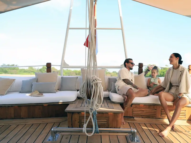 Family on the sundeck of a phinisi