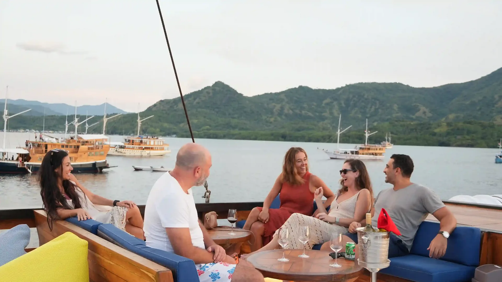 Guests dining on the deck of a yacht