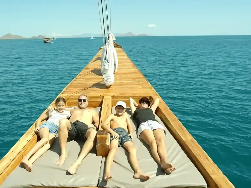 Guests relaxing on the deck of a phinisi
