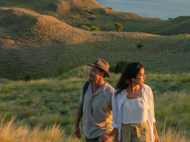 Guests walking with a ranger on the savannah of Rinca Island